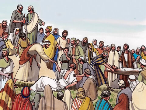 Une grande foule le suivait, parce qu’elle voyait les miracles qu’il opérait sur les malades. – Numéro de diapositive 2